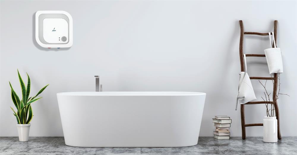 Elegant modern bathroom with white freestanding bathtub and water heater